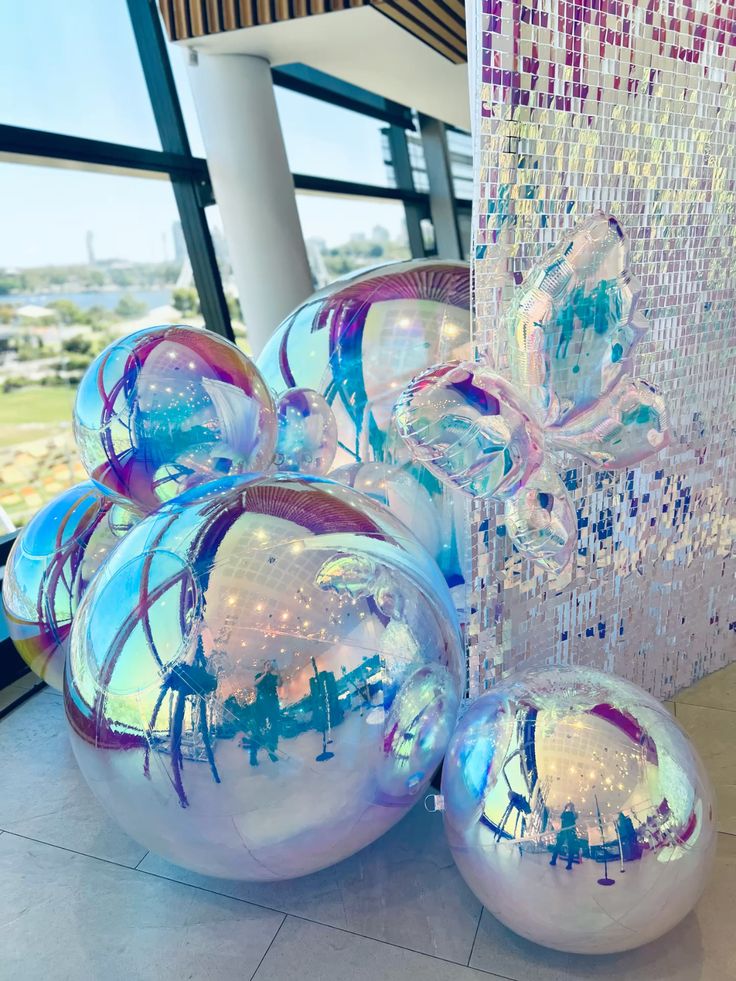 Big Shiny Balls iridescent indoor event décor with sequin wall